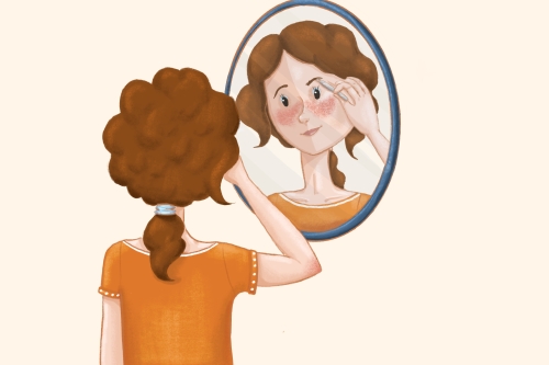 Frau zupft sich die Augenbrauen vor dem Spiegel